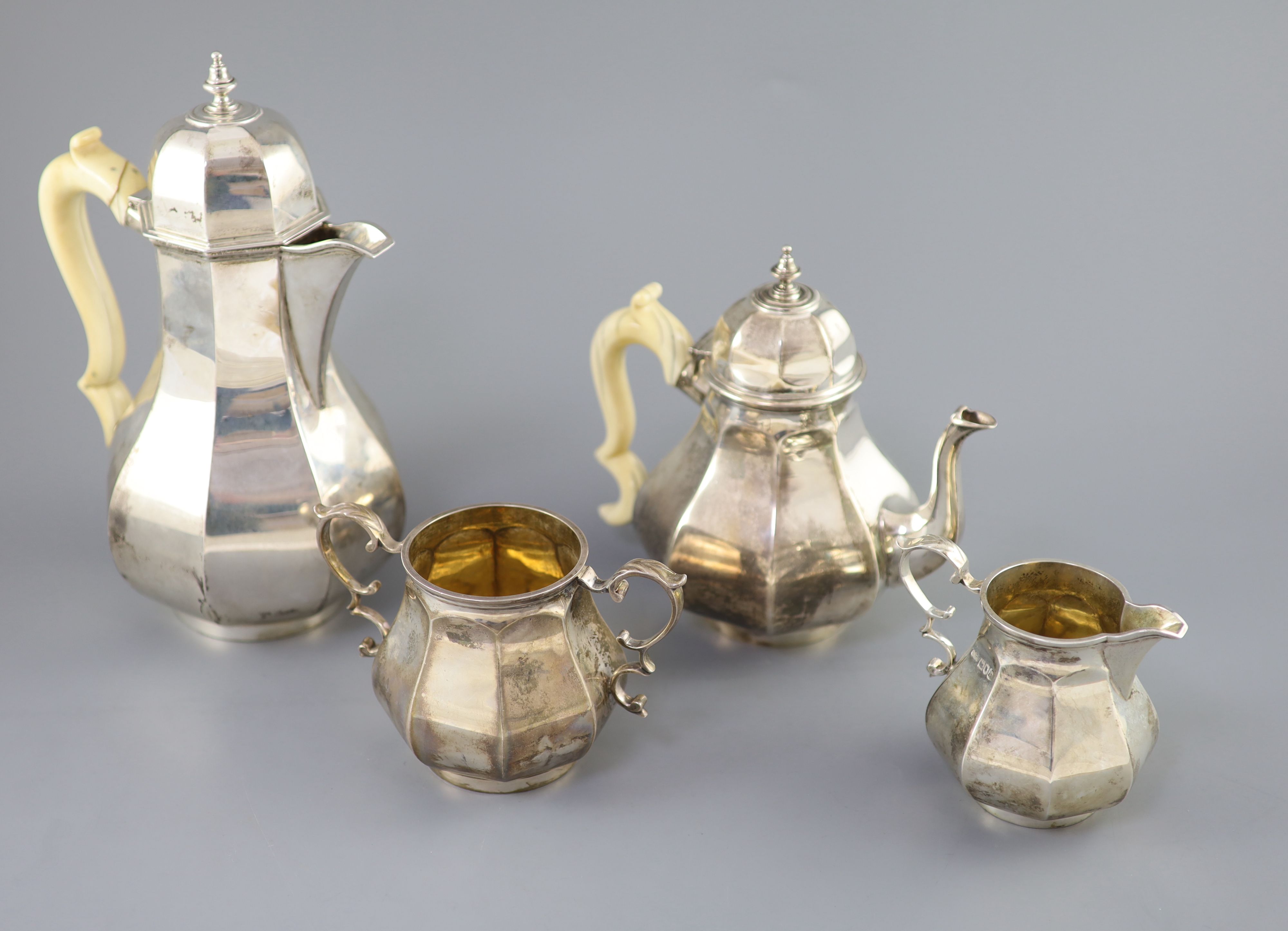 A late Victorian silver four piece Queen Anne style octagonal tea service by Elkington & Co,